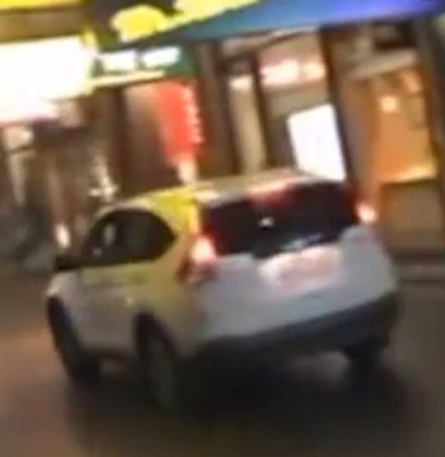 The white Honda narrowly missed pedestrians as it sped down Swanston Street footpath.