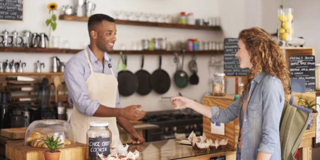 Cropped shot of an attractive young woman placing an order at a coffee shop