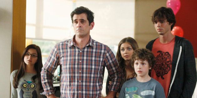 MODERN FAMILY - Emmy and Golden Globe Award-winning 'Modern Family' returns for its fourth season, WEDNESDAY, SEPTEMBER 26 (9:00-9:31 p.m., ET) on the ABC Television Network. In the Season 4 premiere, 'Bringing Up Baby,' Jay's birthday is upon us again and, as before, he makes it well-known that he wishes to keep it as low key as possible, with no grand gestures or surprises. But leave it to the family to miss the mark yet again! Phil takes Jay on a very unconventional fishing trip with his buddies, and Gloria struggles with how to break the pregnancy news to him. Meanwhile, Dylan moves into the Dunphy household temporarily, and Mitch and Cam decide to look into adopting a cat as they continue to cope with their failed attempt to adopt another child. (Photo by Peter 'Hopper' Stone/ABC via Getty Images)ARIEL WINTER, TY BURRELL, SARAH HYLAND, NOLAN GOULD, REID EWING