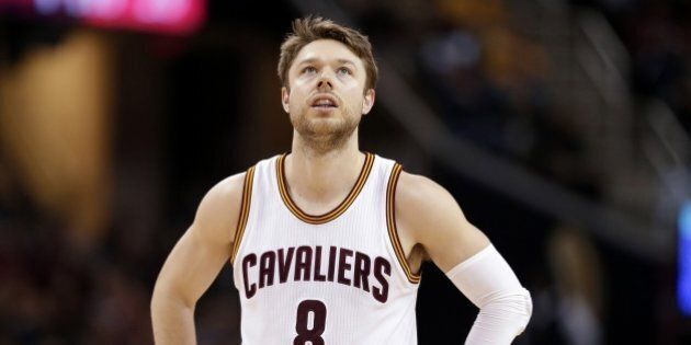 Cleveland Cavaliers' Matthew Dellavedova, from Australia, waits for action to resume in the second half of an NBA basketball game between the Philadelphia 76ers and the Cavaliers, Sunday, Dec. 20, 2015, in Cleveland. (AP Photo/Tony Dejak)