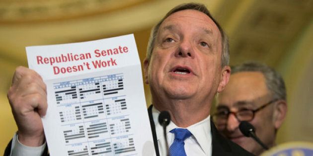 Senate Minority Whip Richard Durbin of Ill., accompanied by Sen. Charles Schumer, D-N.Y., holds up a calendar during a news conference on Capitol Hill in Washington, Tuesday, May 24, 2016. (AP Photo/Evan Vucci)