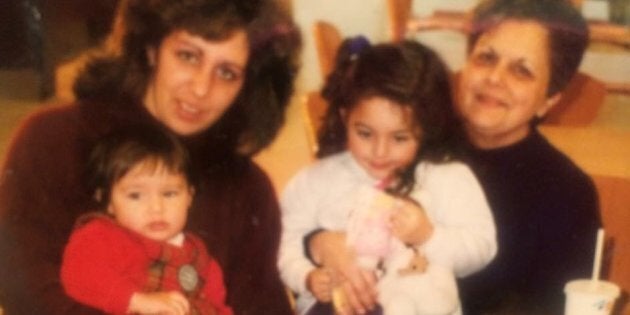 My mother and grandma with me and my sister. My cardigan game was better back then.