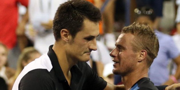 NEW YORK, NY - SEPTEMBER 03: Bernard Tomic of Australia shakes hands with Lleyton Hewitt of Australia after their Men's Singles Second Round match on Day Four of the 2015 US Open at the USTA Billie Jean King National Tennis Center on September 3, 2015 in the Flushing neighborhood of the Queens borough of New York City. (Photo by Streeter Lecka/Getty Images)