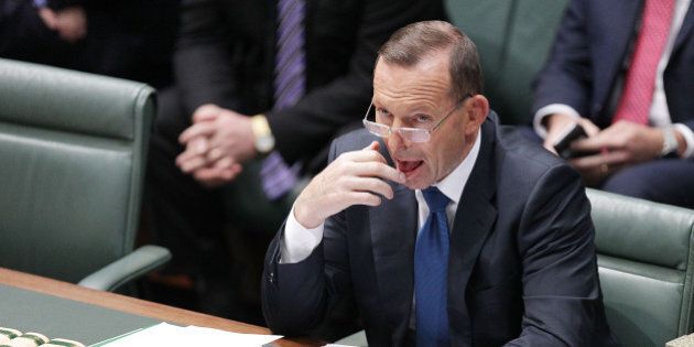 CANBERRA, AUSTRALIA - AUGUST 10: Prime Minister Tony Abbott listens to condolence motions for Donald Randall in the House of Representatives at Parliament House on August 10, 2015 in Canberra, Australia. Bronwyn Bishop resigned as speaker on 3, August following public outcry over travel expenses. (Photo by Stefan Postles/Getty Images)