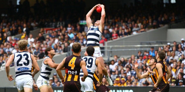 MELBOURNE, VICTORIA - MARCH 28: Patrick Dangerfield of the Cats takes a spectacular mark during the round one AFL match between the Geelong Cats and the Hawthorn Hawks at the Melbourne Cricket Ground on March 28, 2016 in Melbourne, Australia. (Photo by Scott Barbour/AFL Media/Getty Images)