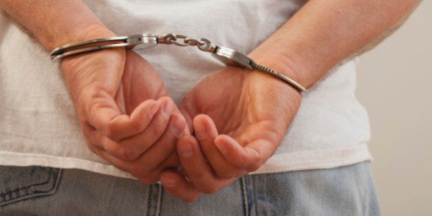 Hands in handcuffs, close-up