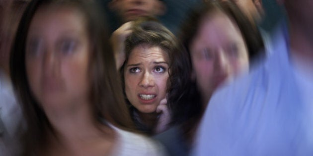 Shot of a fearful young woman feeling trapped by the crowdhttp://195.154.178.81/DATA/i_collage/pi/shoots/783578.jpg