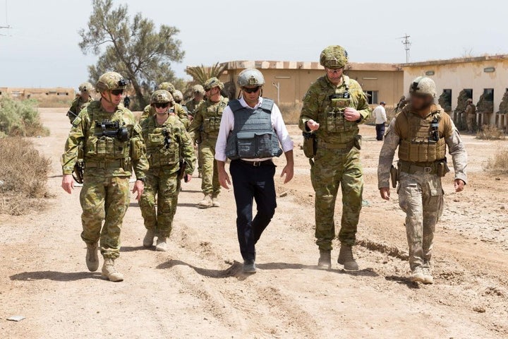 (Centre) Shadow Minister for Defence, The Honourable Richard Marles, MP, talks with Commander Task Group Taji 4, Australian Army officer Colonel Richard Vagg, about training Iraqi Security Forces at Taji Military Complex, Iraq.