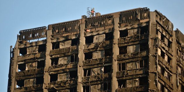 Urban Search and Rescue officers from London Fire Brigade on the roof of Grenfell Tower in west London after a fire engulfed the 24-storey building on Wednesday morning.