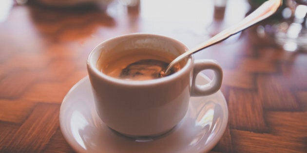 Cuba flag with coffee on table. top view