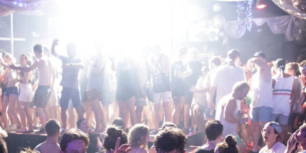 KUTA, BALI, INDONESIA - NOVEMBER 26: Teenagers attend a party in a night club during Australian 'schoolies' celebrations on November 26, 2014 in Kuta, Bali, Indonesia. This year around 6,000 students will travel to Bali to celebrate 'Schoolies Week', which marks the end of the school year. Destinations such as Kuta in Bali are popular among students in search of cheap alcohol and all night parties. (Photo by Agung Parameswara/Getty Images)