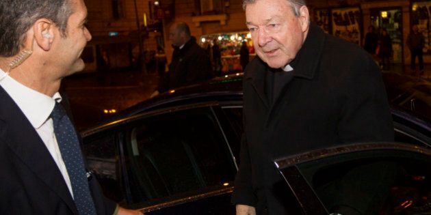 Australian Cardinal George Pell, right, arrives at the Quirinale hotel in Rome, Monday, Feb. 29, 2016, to testify via videolink from the hotel to the Royal Commission sitting in Sydney. Cardinal Pell, one of Pope Francis' top advisers acknowledged Sunday that the Catholic Church