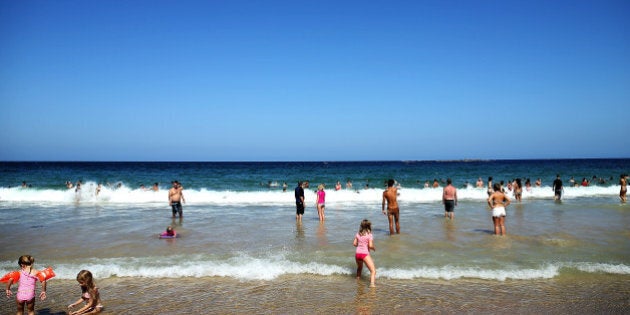 Beachgoers enjoy the hot weather at Coogee Beach on January 13, 2016 in Sydney.