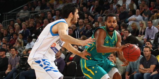 MELBOURNE, AUSTRALIA - JUNE 24: Patty Mills of Australia is pressured by his opponent during the first match between the Australian Boomers and Greece at Hisense Arena on June 24, 2012 in Melbourne, Australia. (Photo by Robert Cianflone/Getty Images)