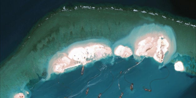 MISCHIEF REEF, CHINA - MARCH 16, 2015: DigitalGlobe imagery from 16 March 2015 shows significant construction and dredging underway at Mischief Reef. New structures, fortified seawalls, and construction equipment are present at multiple sites. (Photo DigitalGlobe via Getty Images)