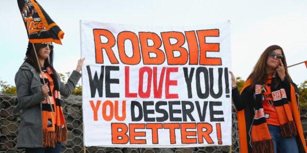 SYDNEY, AUSTRALIA - AUGUST 30: Robbie Farah supporters in the crowd hold up a sign during the round 25 NRL match between the Wests Tigers and the New Zealand Warriors at Campbelltown Sports Stadium on August 30, 2015 in Sydney, Australia. (Photo by Mark Kolbe/Getty Images)