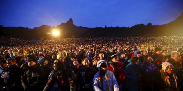 Visitors from Australia and New Zealand attend a dawn ceremony marking the 100th anniversary of the Battle of Gallipoli, at Anzac Cove in Gallipoli April 25, 2015. The battle on Turkey's Gallipoli peninsula was one of the bloodiest of the Great War, as thousands of soldiers from the Australian and New Zealand Army Corps (ANZAC) were cut down by machinegun and artillery fire as they struggled ashore on a narrow beach.The fighting would eventually claim more than 130,000 lives, 87,000 of them on the Ottoman side, before the Turks finally repulsed the poorly planned Allied campaign. REUTERS/Osman Orsal