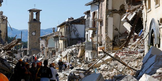 A collapsed house is seen following an earthquake in Amatrice, central Italy, August 24, 2016. REUTERS/Stefano Rellandini