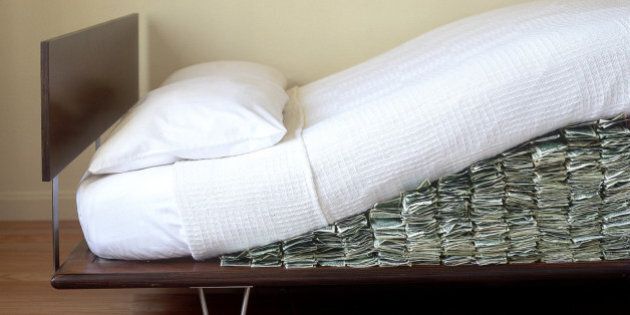 Money hidden under Modern bed mattress