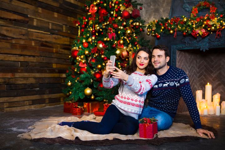 'Let's sit in front of this perfectly decorated Christmas tree and take a candid photo so everyone knows how in love we are -- #relfie'.