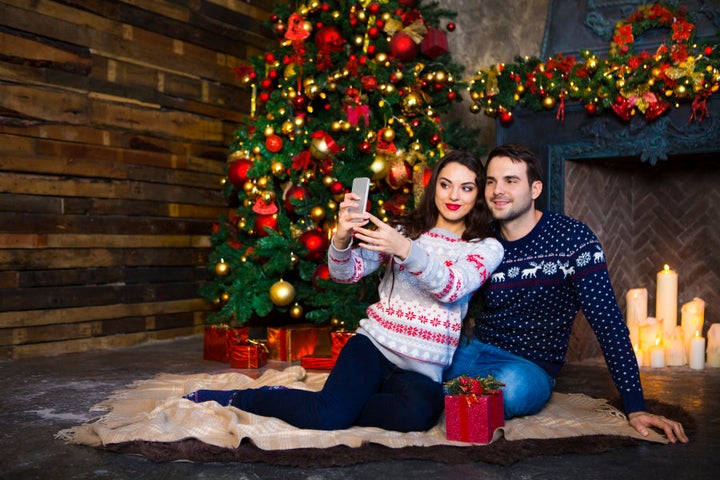 'Let's sit in front of this perfectly decorated Christmas tree and take a candid photo so everyone knows how in love we are -- #relfie'.