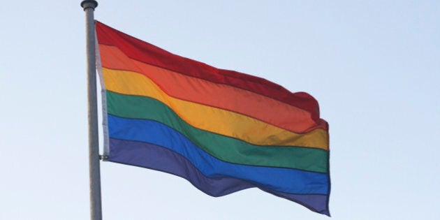 Rainbow flag blowing in wind