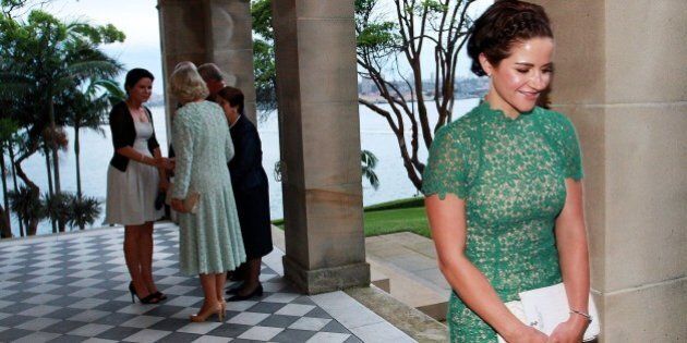 Melbourne Cup winning jockey Michelle Payne (R) smiles after meeting Britain's Camilla, Duchess of Cornwall (2nd L) at Admiralty House in Sydney on November 12, 2015. Prince Charles and his wife Camilla are on a two-week tour of New Zealand and Australia. AFP PHOTO / POOL / LISA MAREE WILLIAMS (Photo credit should read Lisa Maree Williams/AFP/Getty Images)