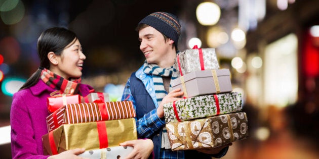 Couple with packages,shopping in city.