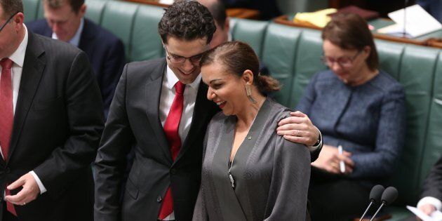 Tim Watts comforts Anne Aly after she was sworn in as the member for Cowan