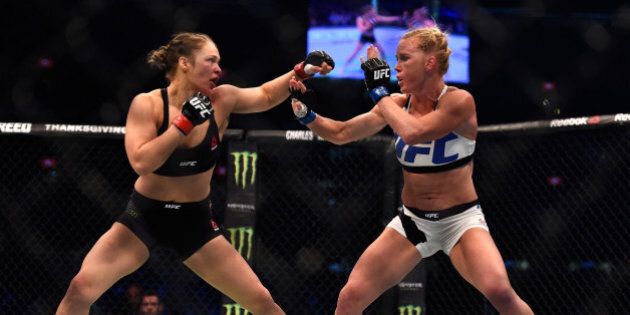 MELBOURNE, AUSTRALIA - NOVEMBER 15: (L-R) Ronda Rousey faces Holly Holm in their UFC women's bantamweight championship bout during the UFC 193 event at Etihad Stadium on November 15, 2015 in Melbourne, Australia. (Photo by Jeff Bottari/Zuffa LLC/Zuffa LLC via Getty Images)
