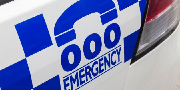 Emergency number 000 in Australia on a police car