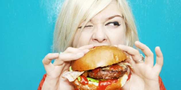 woman eating hamburger