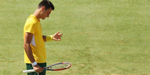 MELBOURNE, AUSTRALIA - MARCH 06: Bernard Tomic of Australia loses a point in his match against John Isner of the USA during the Davis Cup tie between Australia and the United States at Kooyong on March 6, 2016 in Melbourne, Australia. (Photo by Michael Dodge/Getty Images)