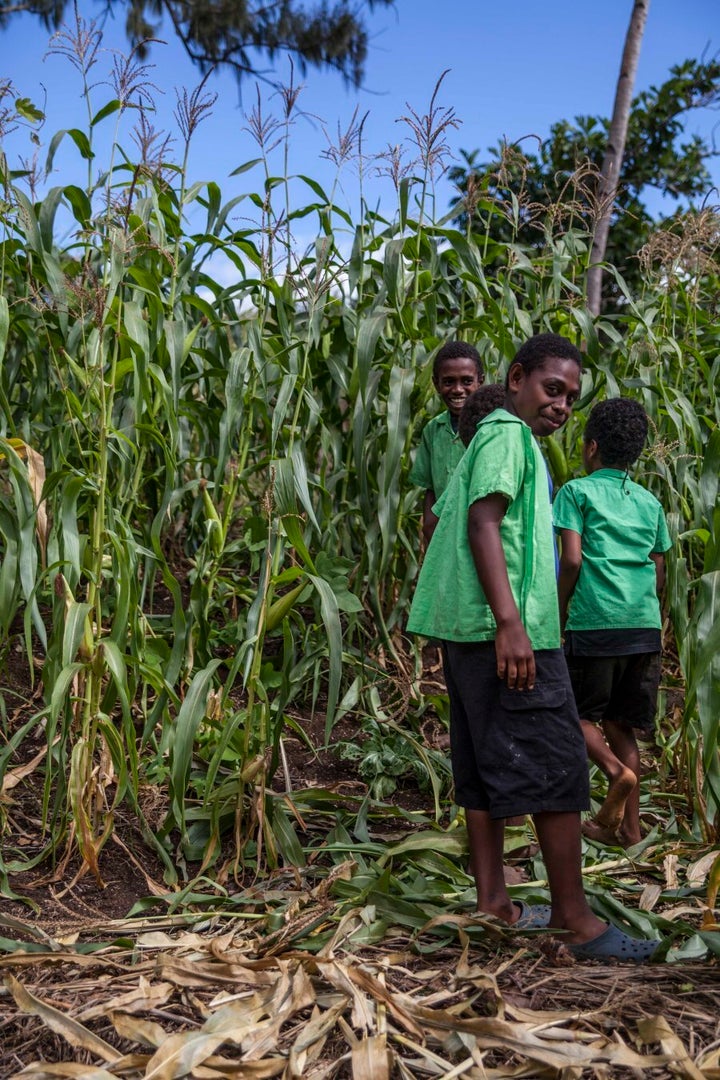 Students guiding through their garden, where they use composted toilet waste to enhance their crops. They have seen an increase in production since fertilising. This type of gardening was also introduced through an NGO and is not found in traditional methods.