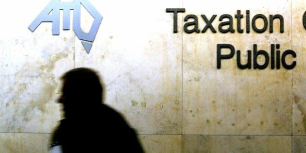 (AUSTRALIA & NEW ZEALAND OUT) A human shadow is visible under the Australian Taxation Department logo, 18 May 2004. AFR Picture by TAMARA VONINSKI (Photo by Fairfax Media via Getty Images)