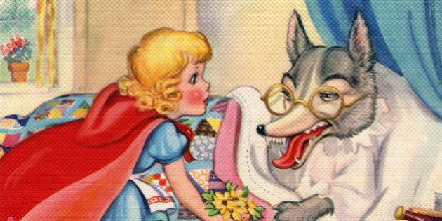 Vintage illustration from the fairy tale Little Red Riding Hood, depicting Riding Hood looking at the Big Bad Wolf's big teeth, c. 1940. Screen print. (Illustration by GraphicaArtis/Getty Images)