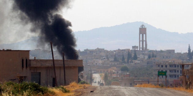 Smoke rises from Taybat al Imam town after rebel fighters from the hardline jihadist Jund al-Aqsa advanced in the town in Hama province, Syria August 31, 2016. REUTERS/Ammar Abdullah