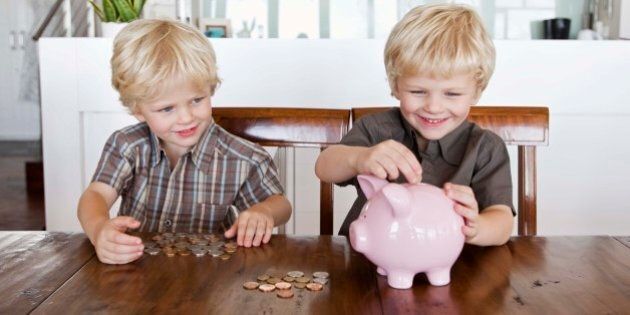 Twin boys and piggy bank