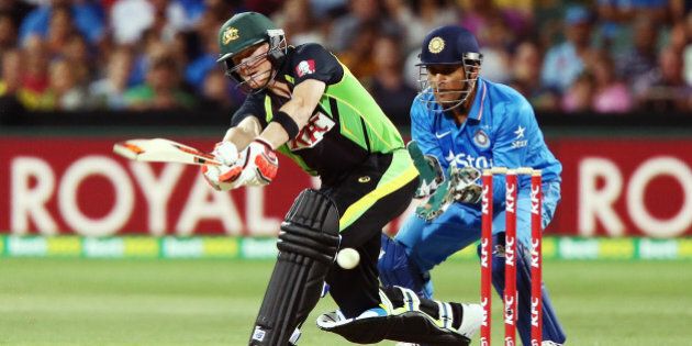 ADELAIDE, AUSTRALIA - JANUARY 26: Steve Smith of Australia bats in front of MS Dhoni of India during game one of the Twenty20 International match between Australia and India at Adelaide Oval on January 26, 2016 in Adelaide, Australia. (Photo by Morne DeKlerk - CA/Cricket Australia/Getty Images)