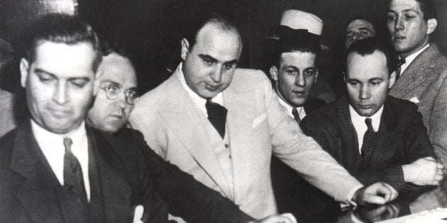 Al Capone signing Uncle Sam's Bail Bond, June 7, 1931, United States. (Photo by: Photo12/UIG via Getty Images)