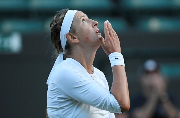 Victoria Azarenka celebrates winning her first round match.