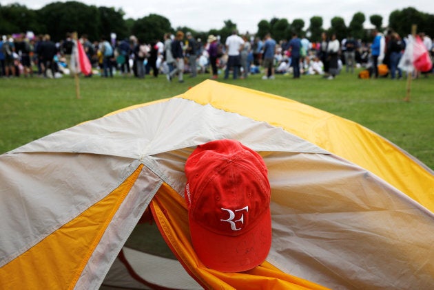 Tennis-lovers from all over the world queued outside Wimbledon before play starts.