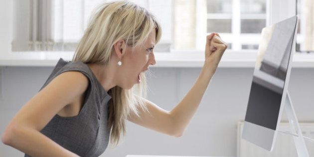 This is too much! Woman is really pissed off with her computer.