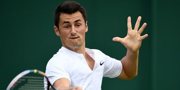 Australia's Bernard Tomic returns against Germany's Mischa Zverev during their men's singles first round match on the second day of the 2017 Wimbledon Championships.