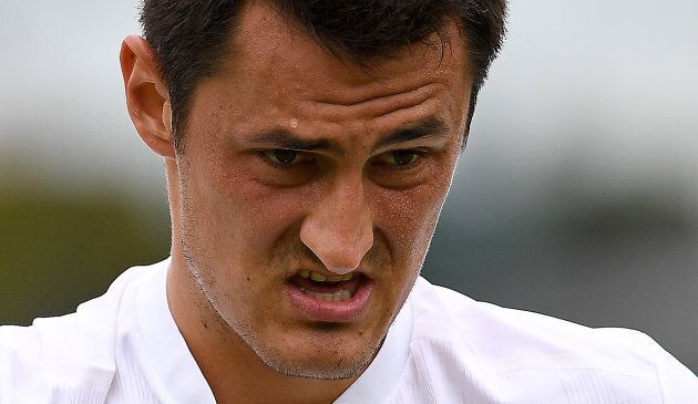 Australia's Bernard Tomic reacts against Germany's Mischa Zverev during their men's singles first round match on the second day of the 2017 Wimbledon Championships.