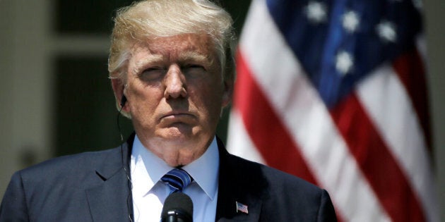 U.S. President Donald Trump listens as South Korean President Moon Jae-in delivers a joint statement from the Rose Garden after meetings at the White House in Washington, U.S. June 30, 2017. REUTERS/Jim Bourg