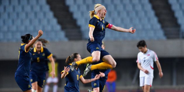 OSAKA, JAPAN - MARCH 07: Captain Clare Polkinghorne of Australia celebrates her team's qualification for the Rio de Janeiro Olympic after her team's 2-1 win in the AFC Women's Olympic Final Qualification Round match between North Korea and Australia at Yanmar Stadium Nagai on March 7, 2016 in Osaka, Japan. (Photo by Koki Nagahama/Getty Images)
