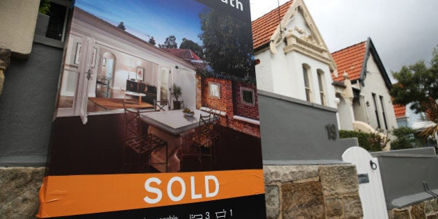 A 'Sold' sign is displayed outside a house in the suburb of Bellevue Hill in Sydney, Australia, on Thursday, June 18, 2015. Surging home prices in cities including Sydney are unlikely to be affected by the banking regulator's efforts to curb mortgage lending to investors, according to National Australia Bank Ltd. Photographer: Brendon Thorne/Bloomberg via Getty Images