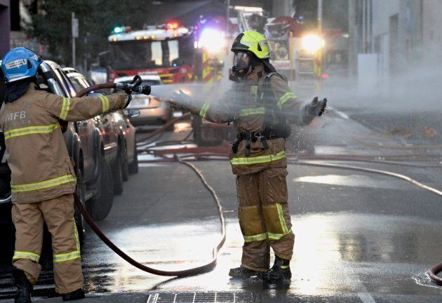 Firefighters being hosed during the factory fire. It reportedly took 25 firefighters 40 minutes to bring the fire under control.
