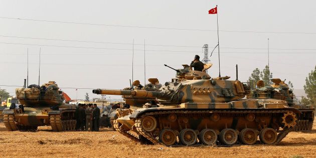 Turkish army tanks and military are stationed in Karkamis on the Turkish-Syrian border in the southeastern Gaziantep province, Turkey, August 25, 2016.